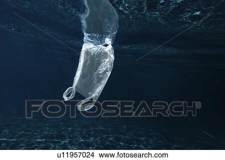 Plastic bag floating in sea View Large Photo Image Picture - Plastic bag floating in sea. Fotosearch