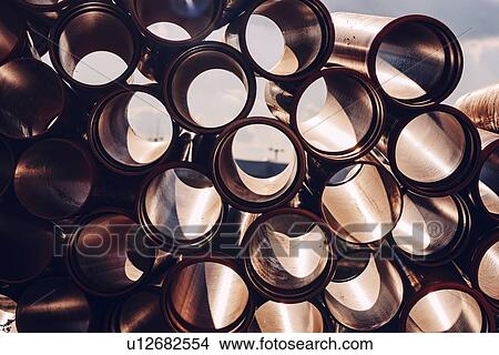 Picture - Plastic sewer pipes on construction site. Fotosearch