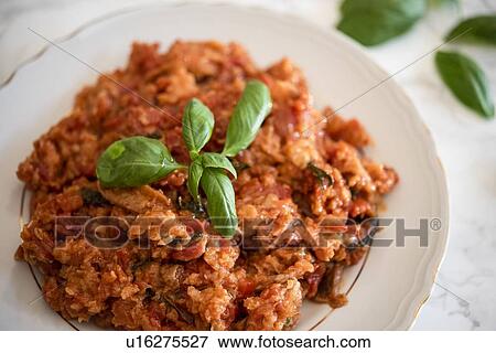 Plate of Pappa al pomodoro (Tuscan bread and tomato soup) garnished with basil View Large Photo Image Stock Photo - Plate of Pappa al pomodoro (Tuscan bread and tomato soup) garnished with basil. Fotosearch
