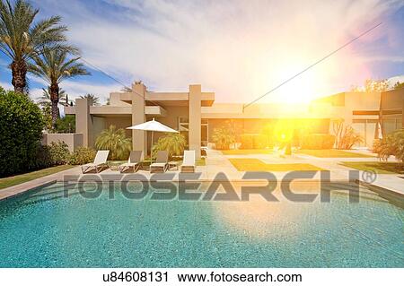 Stock Image - Pool area in luxurious house. Fotosearch
