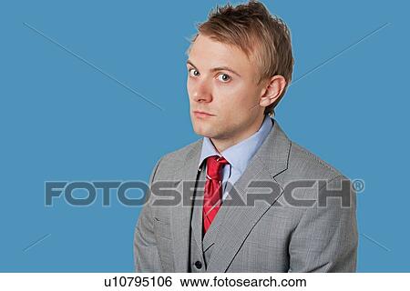 Portrait of angry young businessman wearing grey suit View Large Photo Image Stock Photograph - Portrait of angry young businessman wearing grey suit. Fotosearch