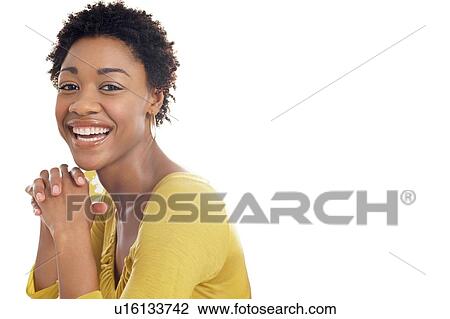 Stock Image - Portrait of Beautiful black african american woman wearing yellow top. Fotosearch