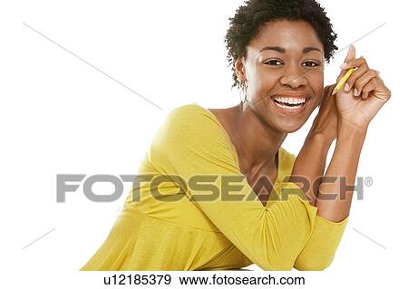 Stock Photo - Portrait of Beautiful black african american woman wearing yellow top. Fotosearch