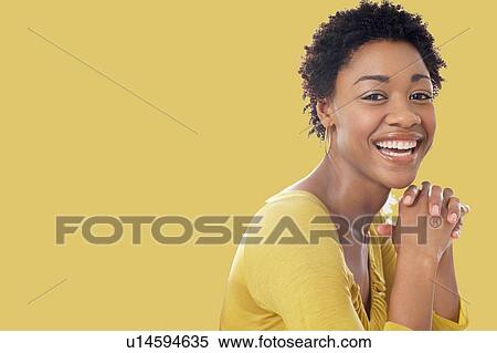 Portrait of Beautiful black african american woman wearing yellow top View Large Photo Image Stock Photography - Portrait of Beautiful black african american woman wearing yellow top. Fotosearch