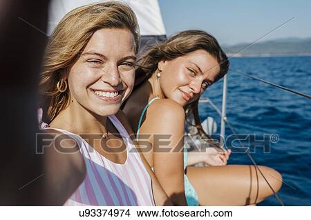Portrait of friends on sailboat View Large Photo Image Picture - Portrait of friends on sailboat. Fotosearch