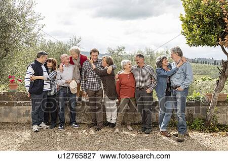 Portrait of loving senior couples, olive trees in background, Florence, Italy View Large Photo Image Stock Photo - Portrait of loving senior couples, olive trees in background, Florence, Italy. Fotosearch