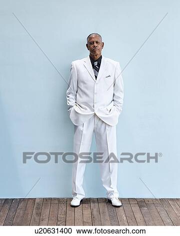 Portrait of senior businessman, blue background View Large Photo Image Stock Image - Portrait of senior businessman, blue background. Fotosearch