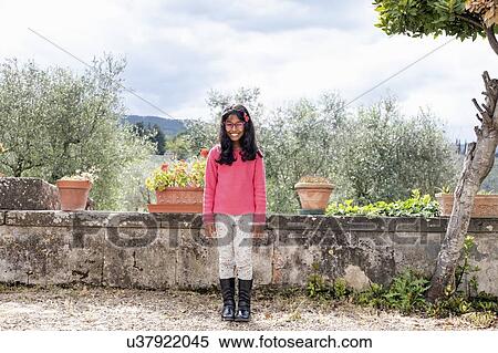 Portrait of young girl, olive trees in background, Florence, Italy View Large Photo Image Stock Photography - Portrait of young girl, olive trees in background, Florence, Italy. Fotosearch