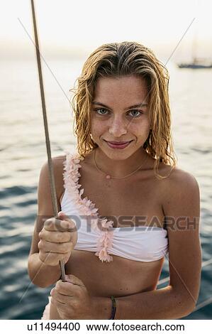 Portrait of young woman on sailboat, Italy View Large Photo Image Stock Image - Portrait of young woman on sailboat, Italy. Fotosearch
