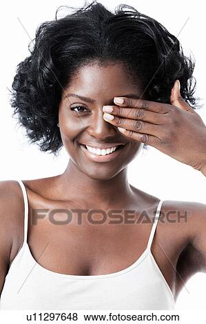Pretty Black woman with hand over left eye View Large Photo Image Stock Photo - Pretty Black woman with hand over left eye. Fotosearch