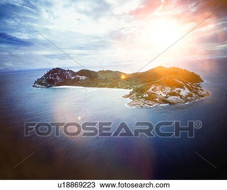 Private island in the ocean with sun shining View Large Photo Image Stock Image - Private island in the ocean with sun shining. Fotosearch