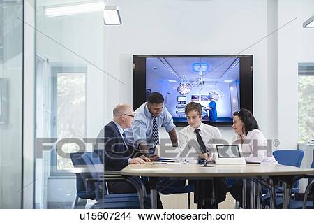 Picture - Product development office workers in meeting. Fotosearch