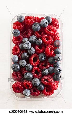 Raspberries and blueberries View Large Photo Image Stock Image - Raspberries and blueberries. Fotosearch