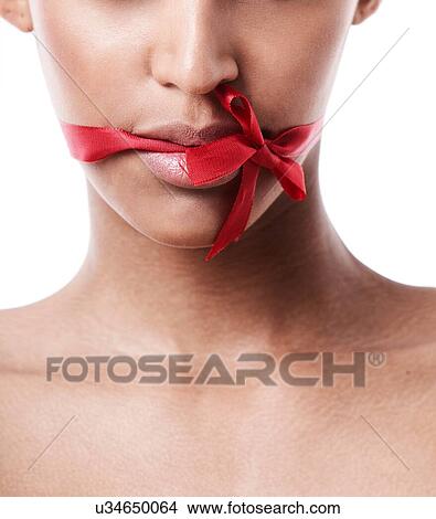 Red bow tied over womans mouth View Large Photo Image Picture - Red bow tied over womans mouth. Fotosearch
