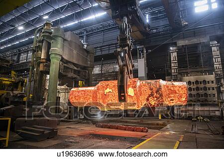 Red hot steel ingot being craned to forge in steelworks View Large Photo Image Stock Photograph - Red hot steel ingot being craned to forge in steelworks. Fotosearch