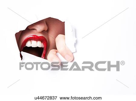 Red Lips and mouth peering through ripped paper View Large Photo Image Stock Photo - Red Lips and mouth peering through ripped paper. Fotosearch