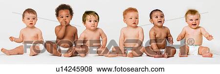 Stock Photo - Row of six multi ethnic Babies smiling in studio. Fotosearch