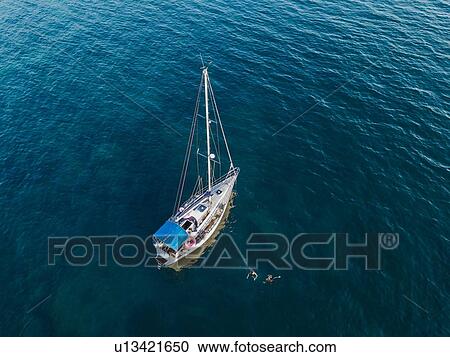 Sailboat afloat on sea, Italy View Large Photo Image Stock Image - Sailboat afloat on sea, Italy. Fotosearch
