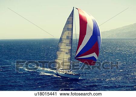 Stock Image - Sailboat in race on the ocean. Fotosearch