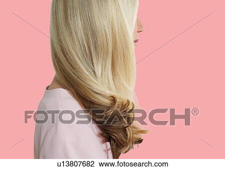 Senior woman with long blonde hair standing over pink background View Large Photo Image Stock Image - Senior woman with long blonde hair standing over pink background. Fotosearch