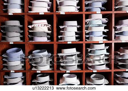 Shirts on shelves in tailor shop View Large Photo Image Stock Image - Shirts on shelves in tailor shop. Fotosearch