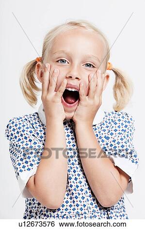 Stock Photograph - Shocked little blonde girl. Fotosearch