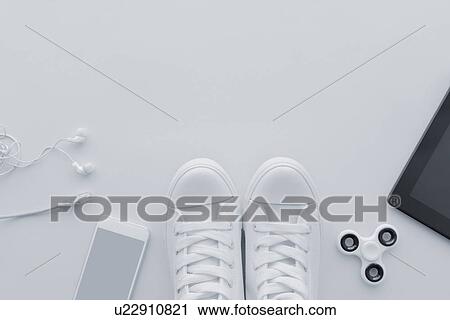Stock Image - Shoes and gadgets. Fotosearch