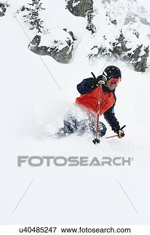 Skier skiing and splashing snow View Large Photo Image Stock Photo - Skier skiing and splashing snow. Fotosearch