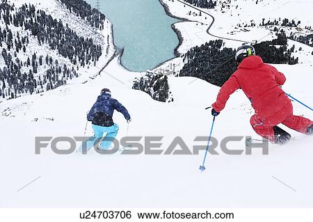 Stock Photograph - Skiers skiing, Khtai, Tyrol, Austria. Fotosearch