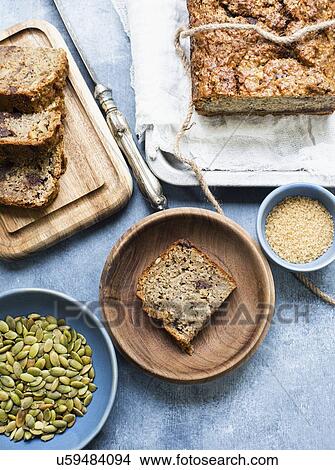 Slices of baked bread with pumpkin seeds and chocolate chips View Large Photo Image Picture - Slices of baked bread with pumpkin seeds and chocolate chips. Fotosearch
