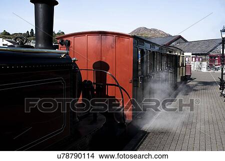 Picture - Steam train stopping at station. Fotosearch
