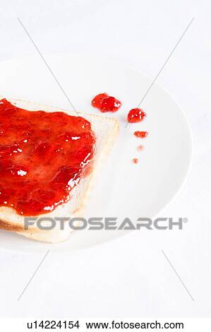 Strawberry jam jelly on toast View Large Photo Image Picture - Strawberry jam jelly on toast. Fotosearch