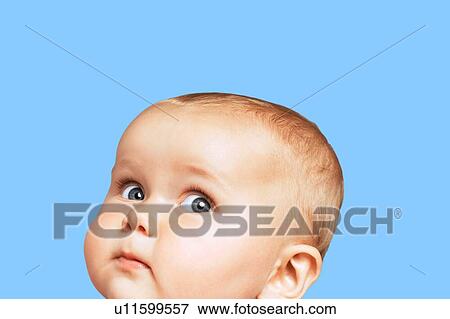 Stock Photo - Surprised Baby Boy on Blue Background. Fotosearch