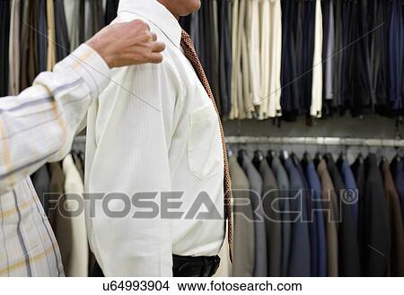 Tailor measuring business man for suit View Large Photo Image Picture - Tailor measuring business man for suit. Fotosearch