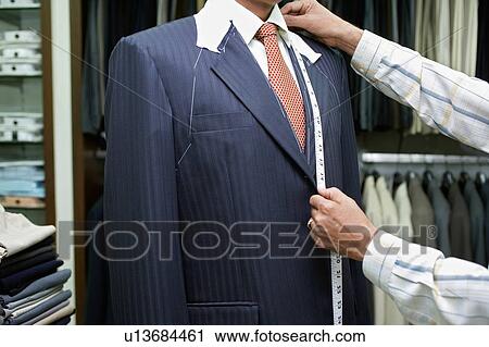 Tailor measuring business man for suit View Large Photo Image Stock Image - Tailor measuring business man for suit. Fotosearch