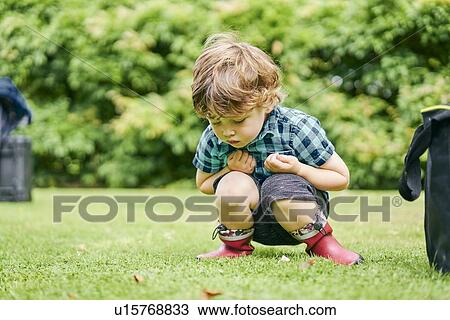 Stock Image - Toddler exploring park. Fotosearch