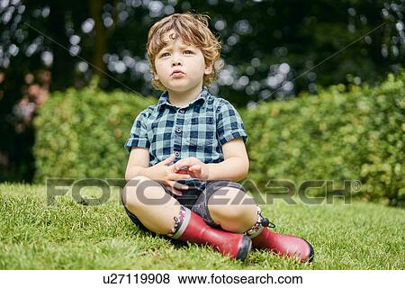 Stock Photo - Toddler exploring park. Fotosearch