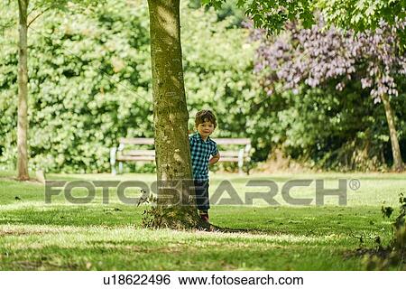 Stock Photograph - Toddler exploring park. Fotosearch