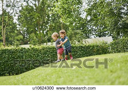 Stock Image - Toddlers exploring park. Fotosearch