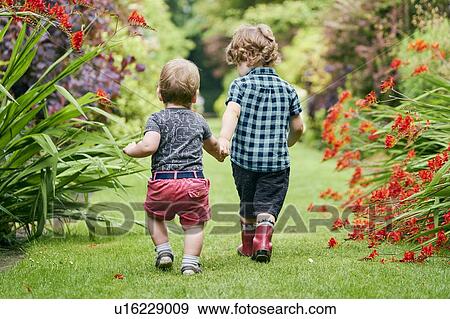 Stock Photo - Toddlers exploring park. Fotosearch