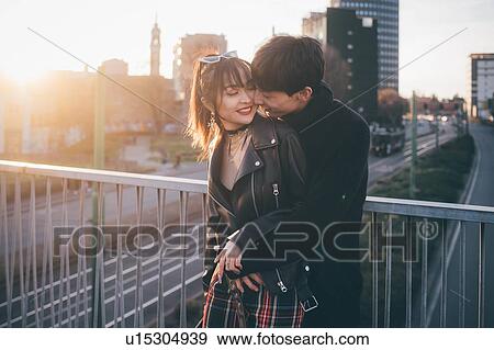 Trendy couple hugging on bridge, Milan, Italy View Large Photo Image Stock Photo - Trendy couple hugging on bridge, Milan, Italy. Fotosearch