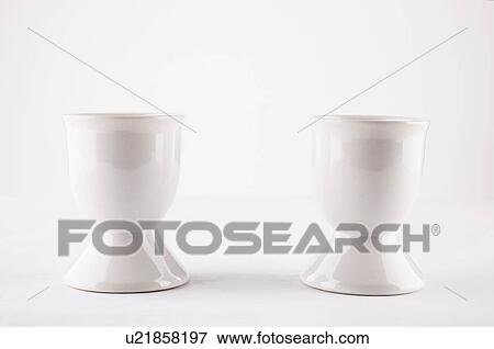 Stock Photo - Two white egg cups. Fotosearch