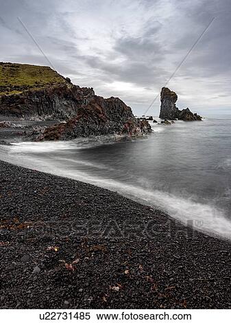 Stock Photography - Volcanic rock formations on black sand beach, Snaefellsbaer, Vesturland, Iceland. Fotosearch