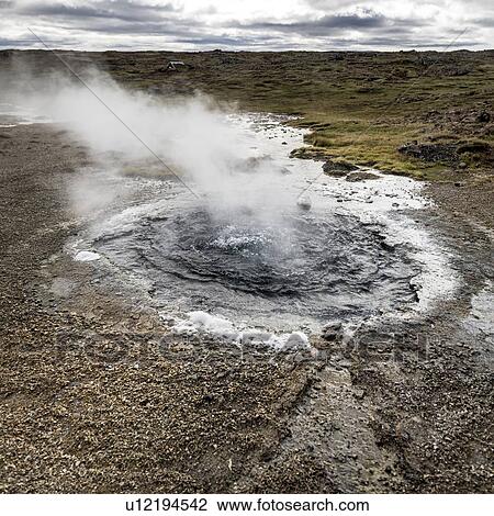 Stock Image - Volcanic spring, view of a natural hot spring and pool of hot water, Hunavatnshreppur, Nordurland Vestra, Iceland. Fotosearch