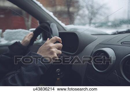 Picture - Waiting in car on winter day. Fotosearch