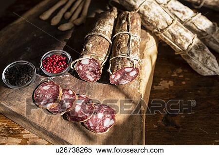Whole salami, cut and sliced, peppercorn View Large Photo Image Stock Photography - Whole salami, cut and sliced, peppercorn. Fotosearch