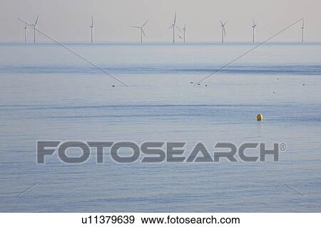 Stock Photo - Wind farm in ocean. Fotosearch