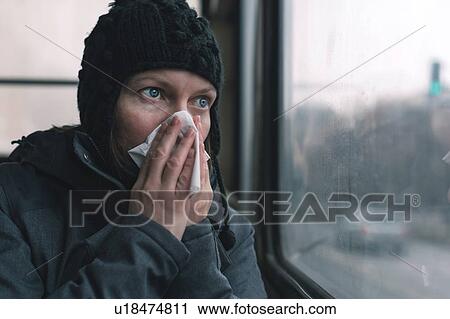 Woman blowing her nose View Large Photo Image Stock Image - Woman blowing her nose. Fotosearch