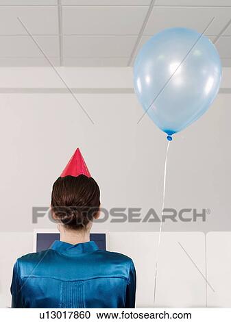 Stock Image - Woman Having Birthday over video conferencing due to social distancing. Fotosearch