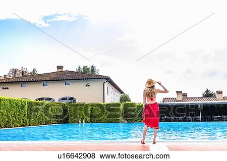 Woman in red bikini by swimming pool View Large Photo Image Stock Photo - Woman in red bikini by swimming pool. Fotosearch